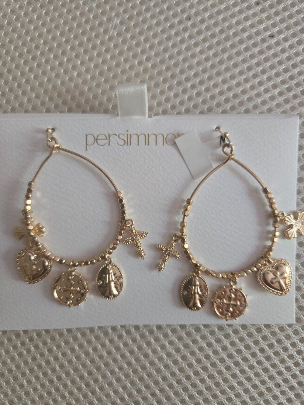 Persimmon dangle earrings, gold tone with charms